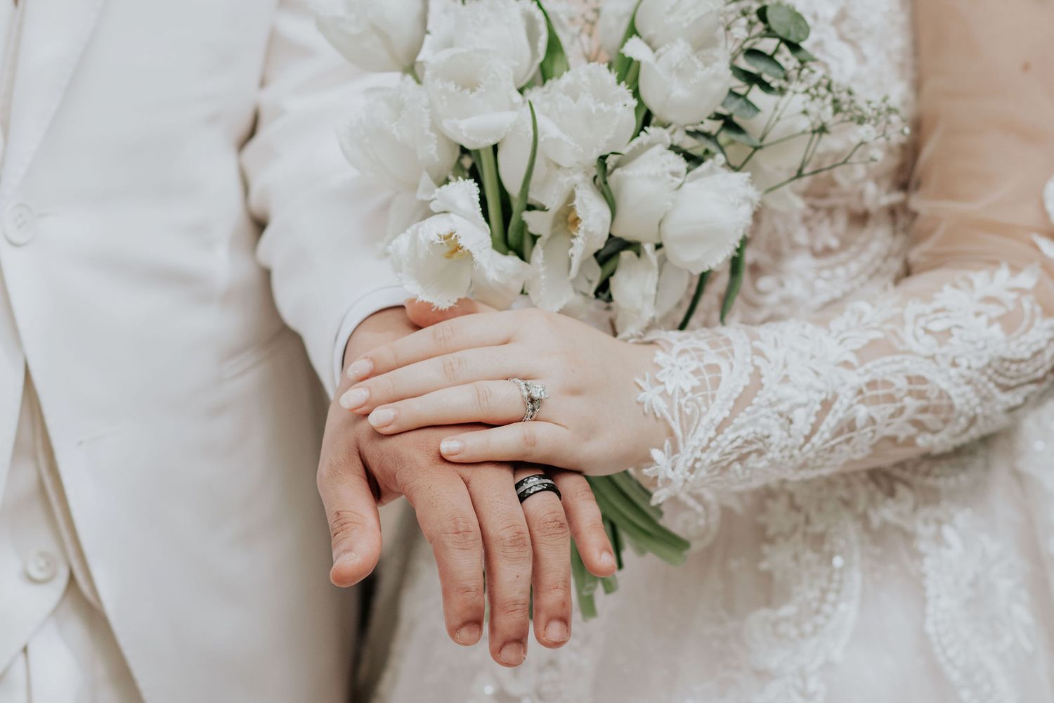 Delicate white roses and floral bouquet details with lace dress elements.