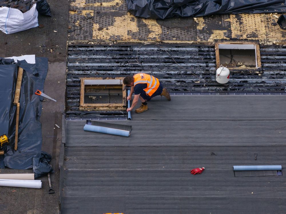 A sequence of DIY home renovation photos showing wood plank repairs on a deck surface.