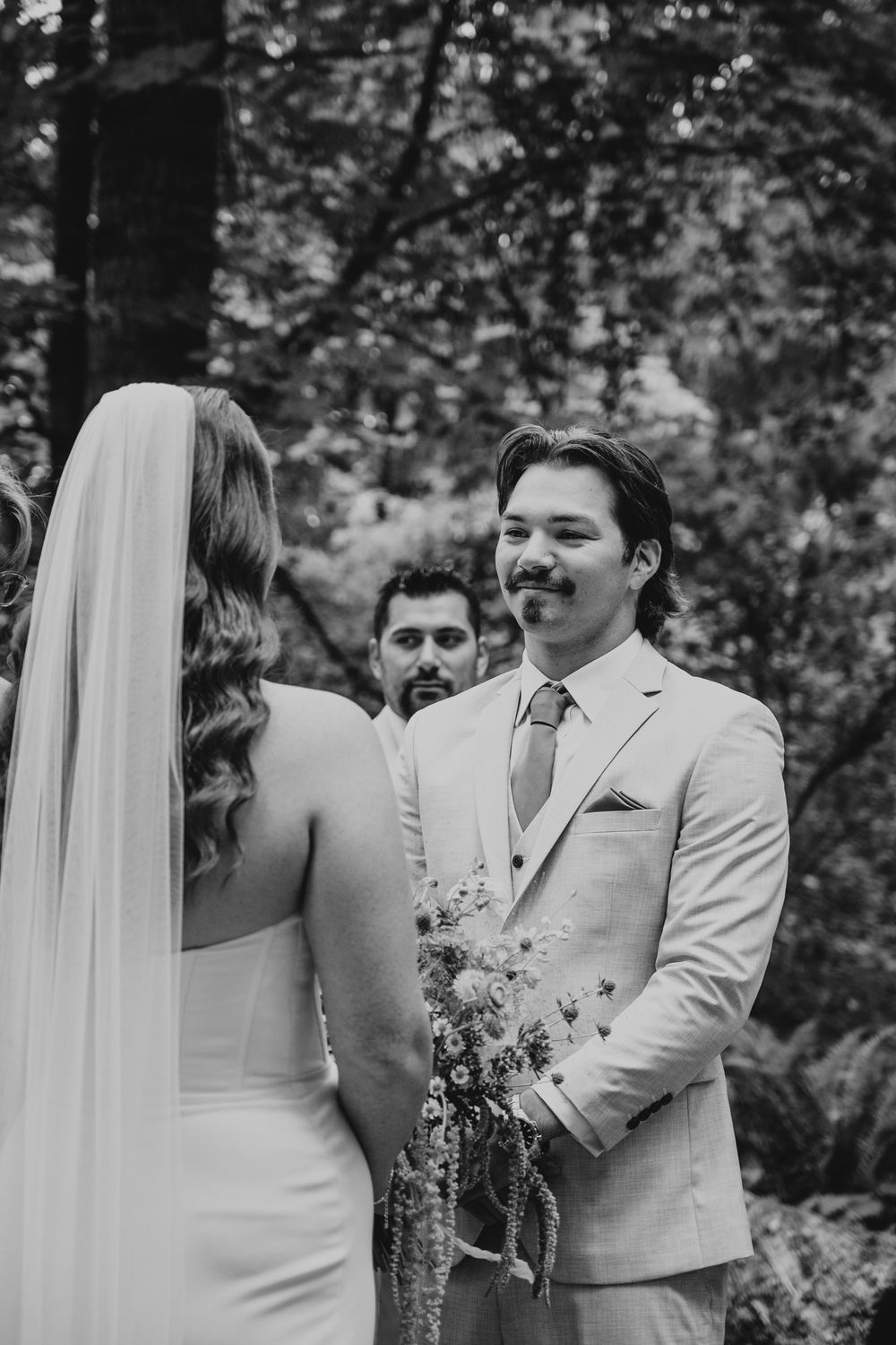 Vancouver Island Wedding photographer photography of couple at Miracle Beach during wedding ceremony saying vows