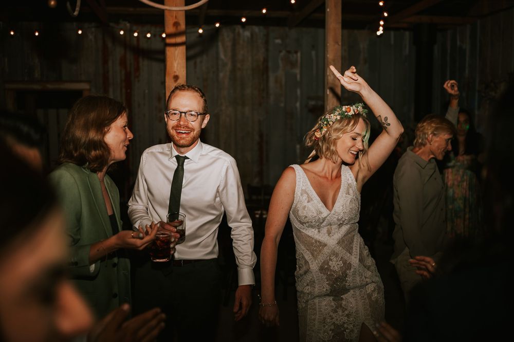 Vancouver Island Wedding photographer photography of couple Dancing in barn at Smith Lake farm during wedding reception