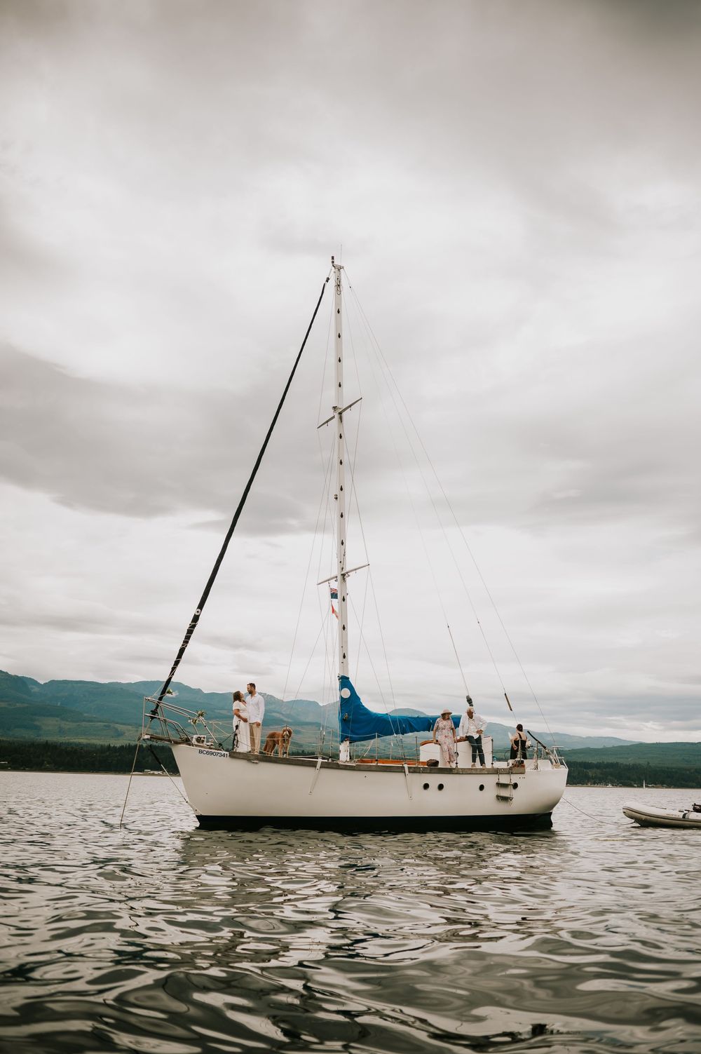Vancouver Island Wedding photographer photography of couple elopement on sail boat for their wedding venue by Buckley Bay dock and Denman