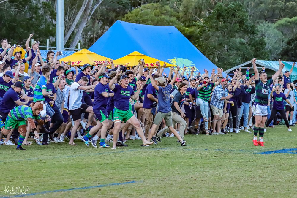 Crowd cheering at sporting event photo taken by Sunshine Coast Sports Photographer, Rachel Wright
