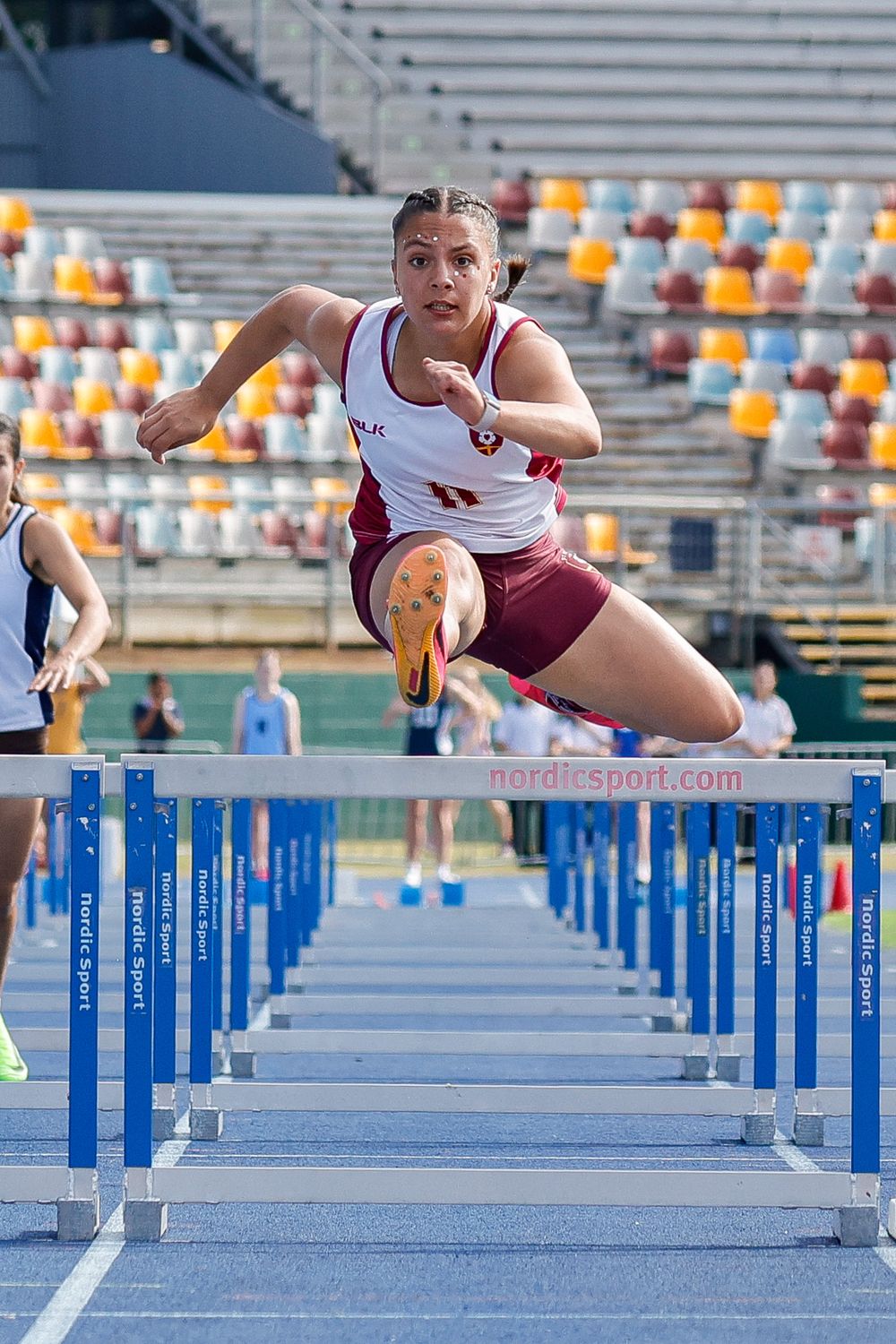 Athletics hurdles action sports photo taken by Sunshine Coast Sports Photographer, Rachel Wright