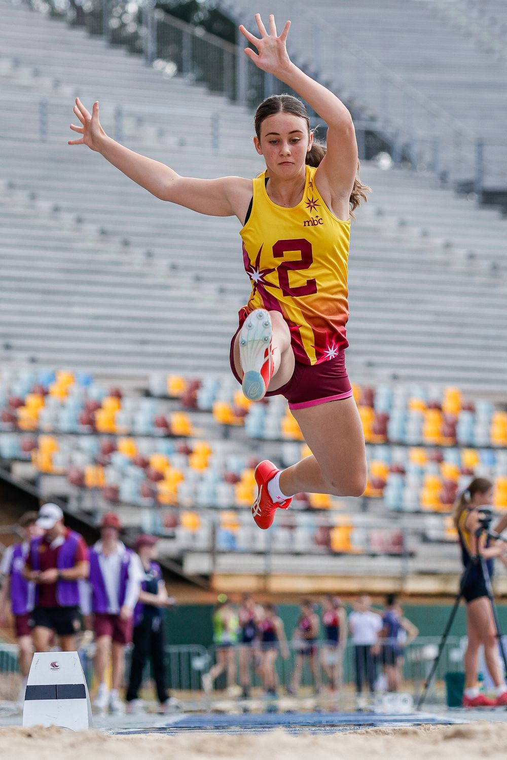 Athletics long jump action sports photo taken by Sunshine Coast Sports Photographer, Rachel Wright