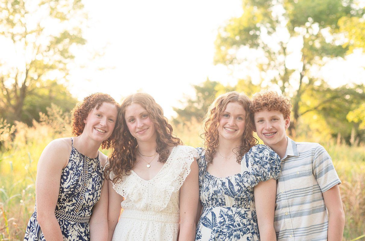 Family of 6 Outdoor Field Summer Portraits by Bartlesville Photographer Kristi Bray Photography