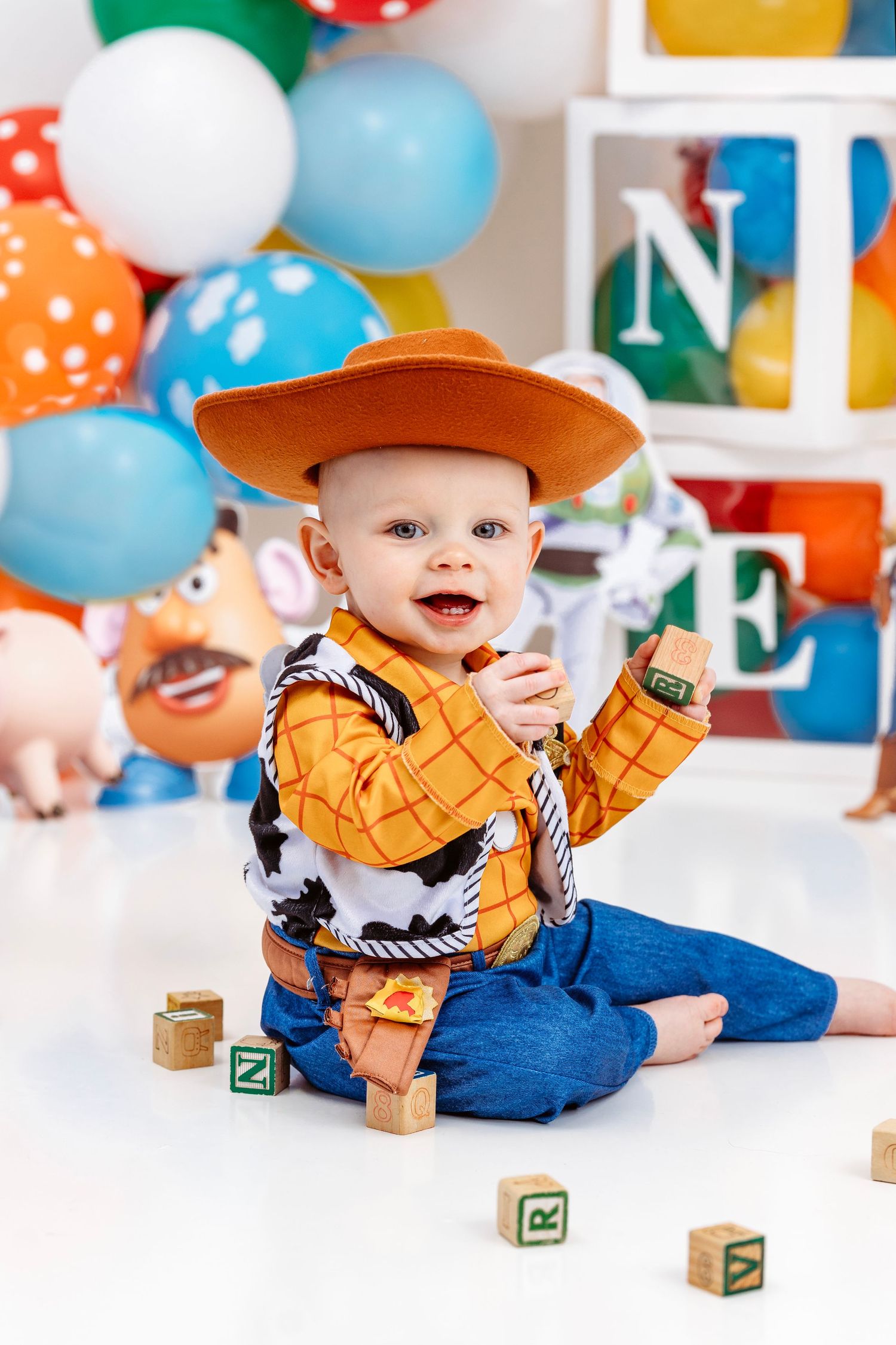 one year old dressed up as Woody from Toy Story. Middle TN milestone photographer.