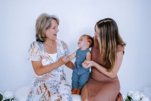 Candid studio portraits showing joyful interaction between family members.