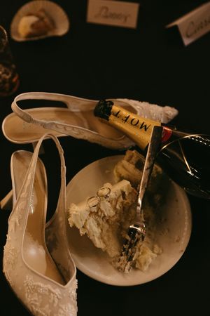 A flatlay of wedding details at night during the reception.