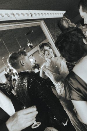 Bride and groom capturing intimate dance moments at a celebration.