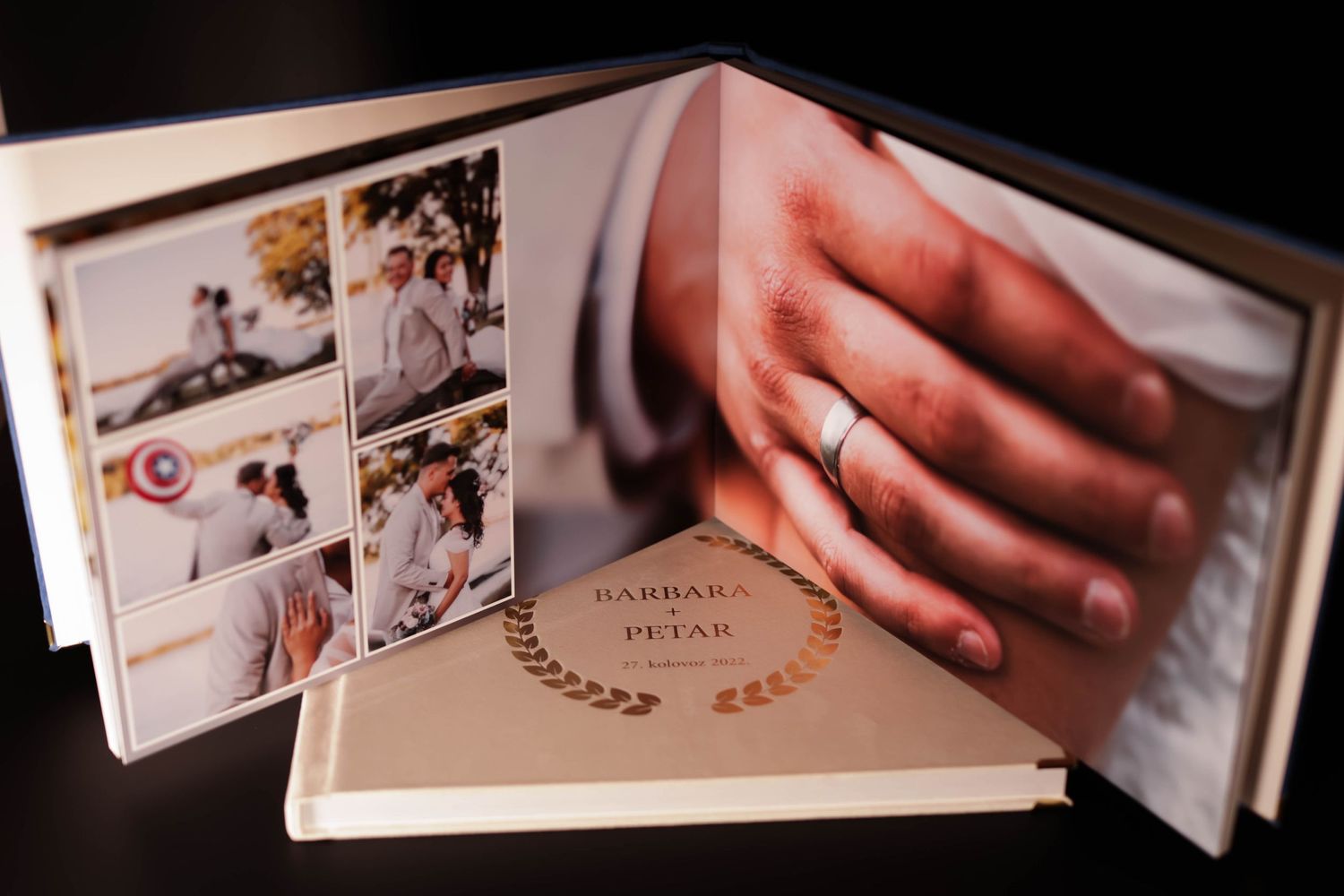 Wedding photo album spread displaying intimate moments and details across its pages.