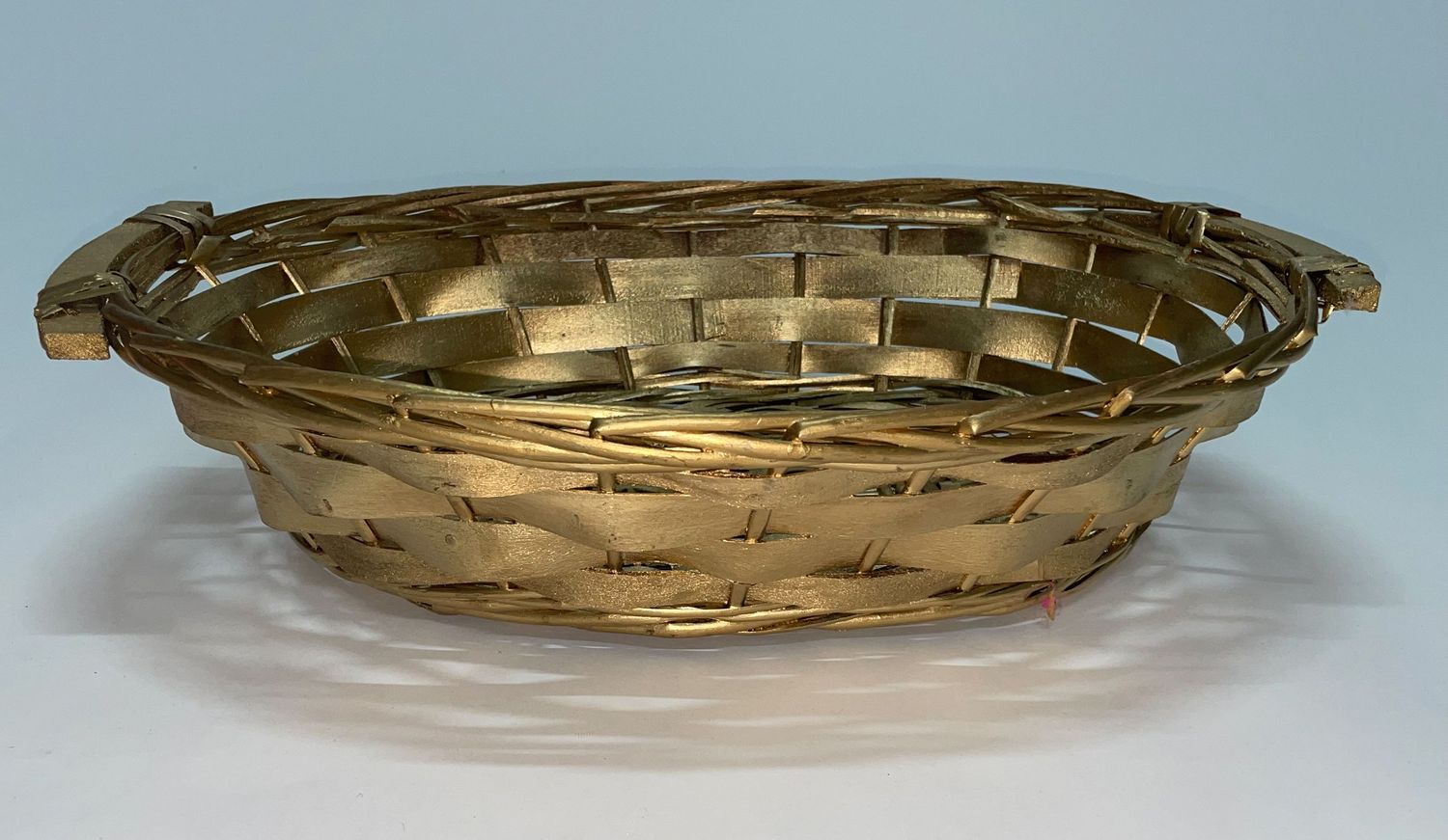 Gold woven basket or decorative tray shown from multiple angles on white background.