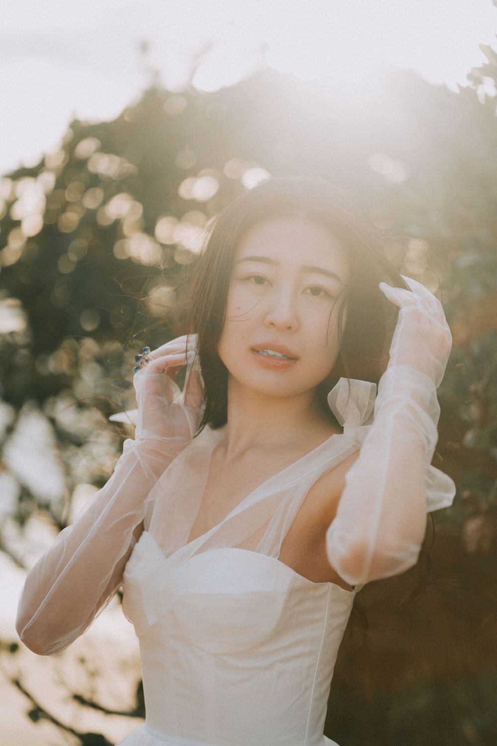 Beautiful asian bride enjoying warm sunset