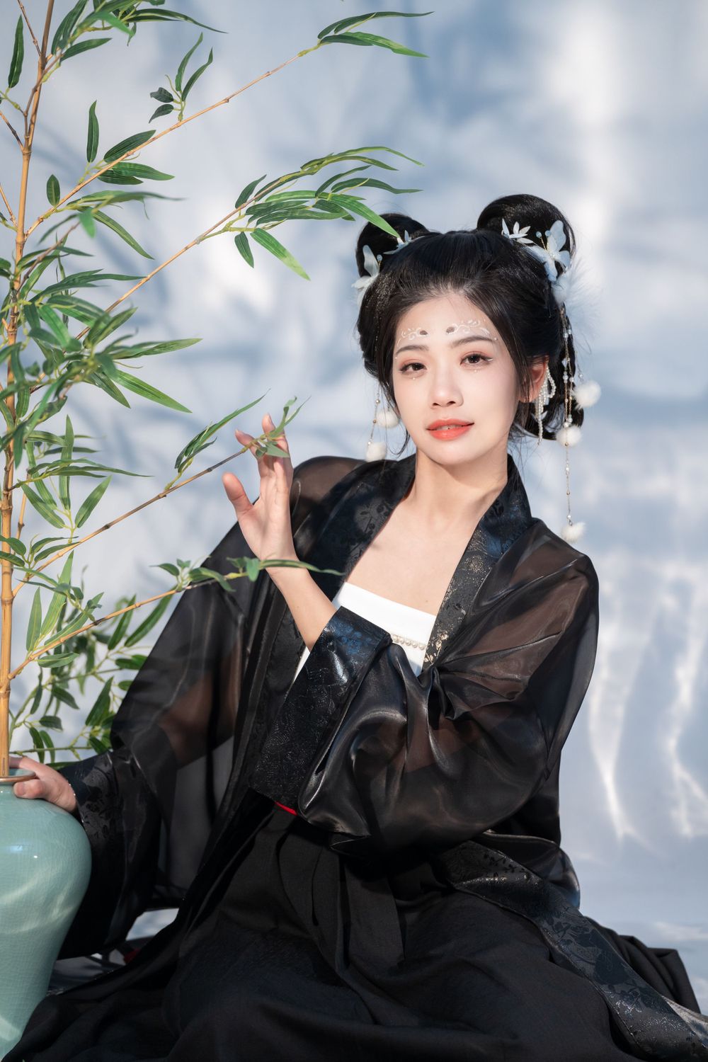 Emotional cinematic studio portrait in panda Hanfu cosplay among bamboo, smiling through tears, by Imagine Image Studio.