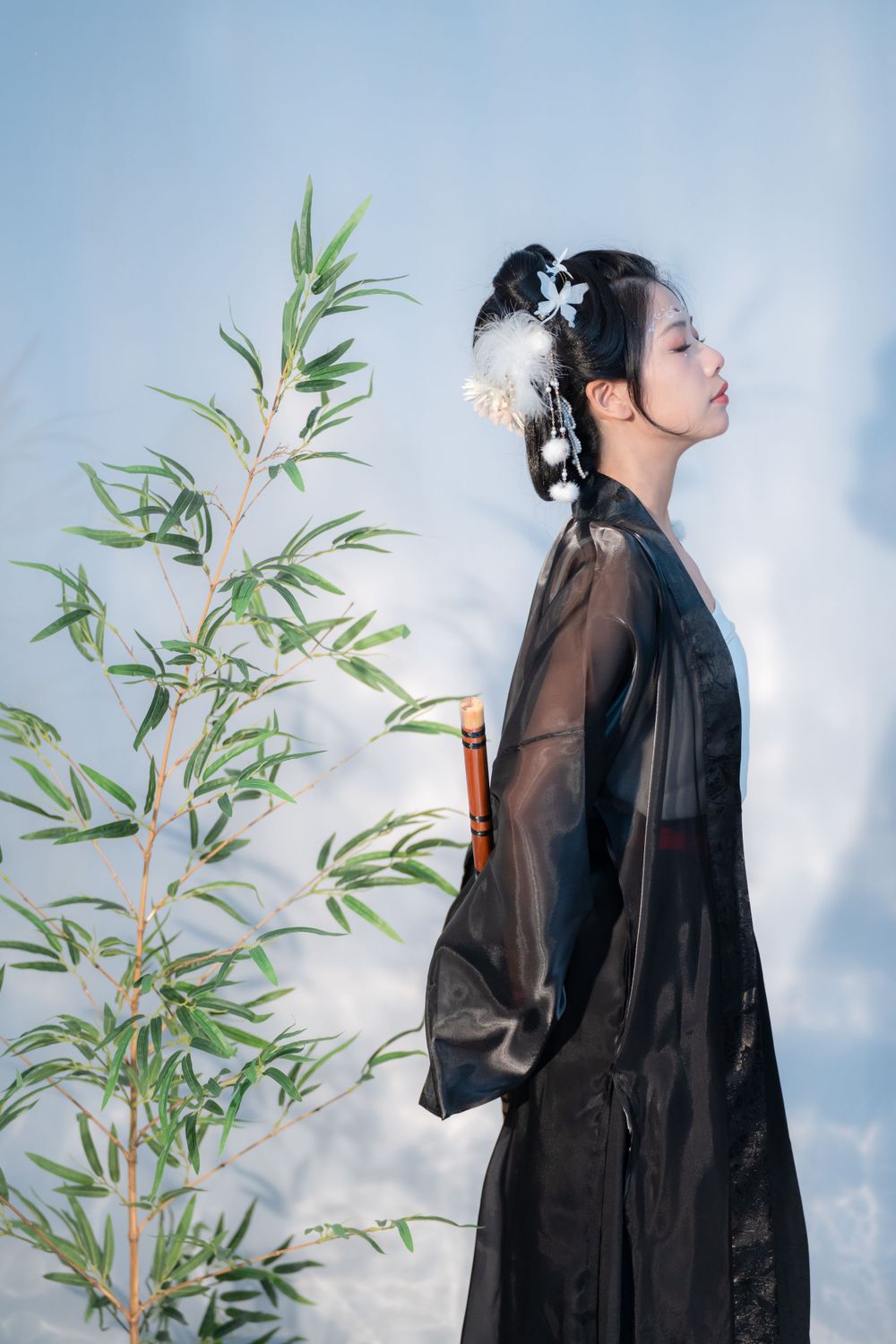 Emotional cinematic studio portrait in panda Hanfu cosplay among bamboo, smiling through tears, by Imagine Image Studio.