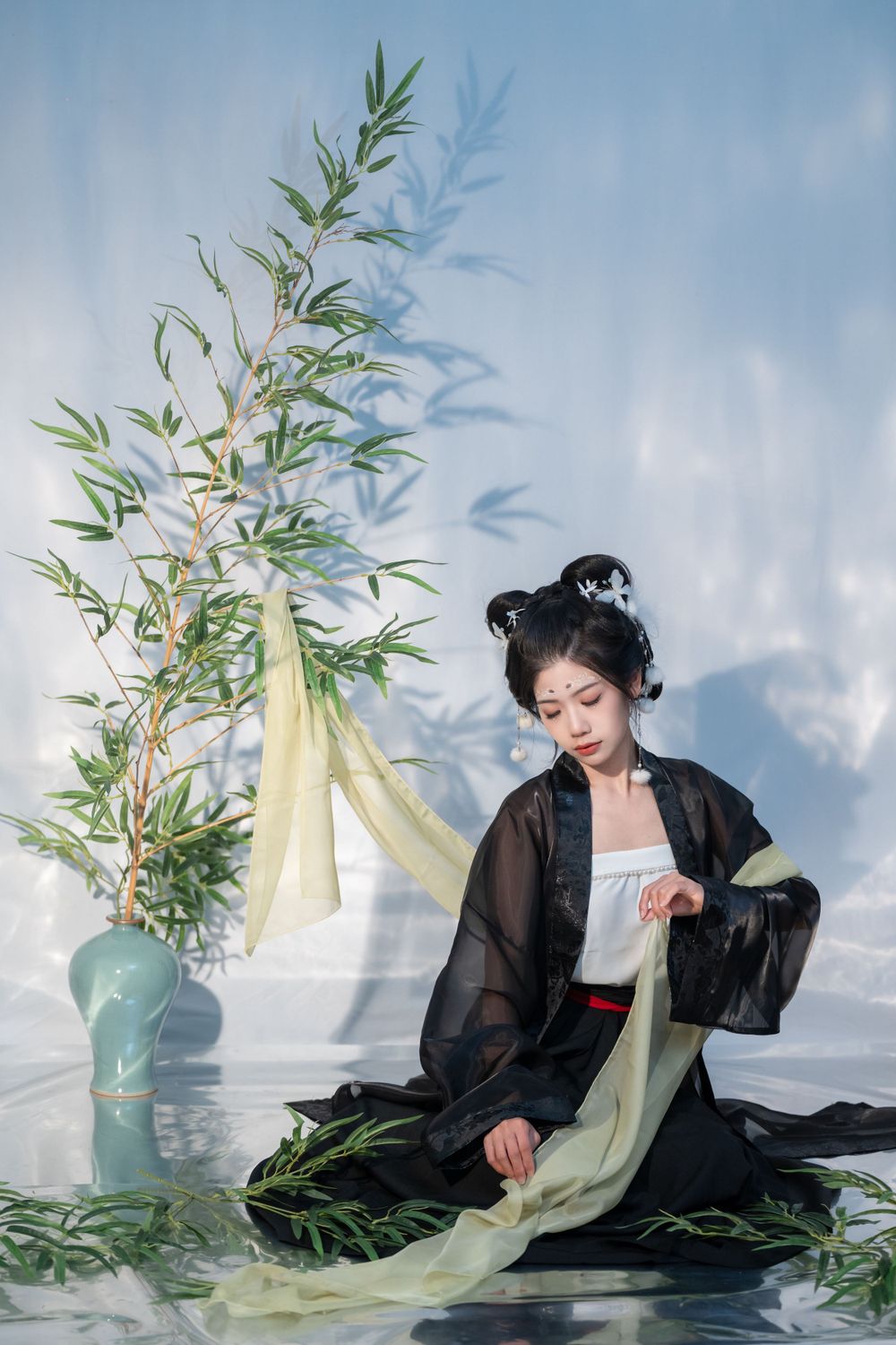 Emotional cinematic studio portrait in panda Hanfu cosplay among bamboo, smiling through tears, by Imagine Image Studio.