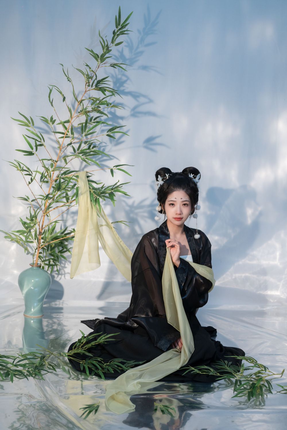 Emotional cinematic studio portrait in panda Hanfu cosplay among bamboo, smiling through tears, by Imagine Image Studio.