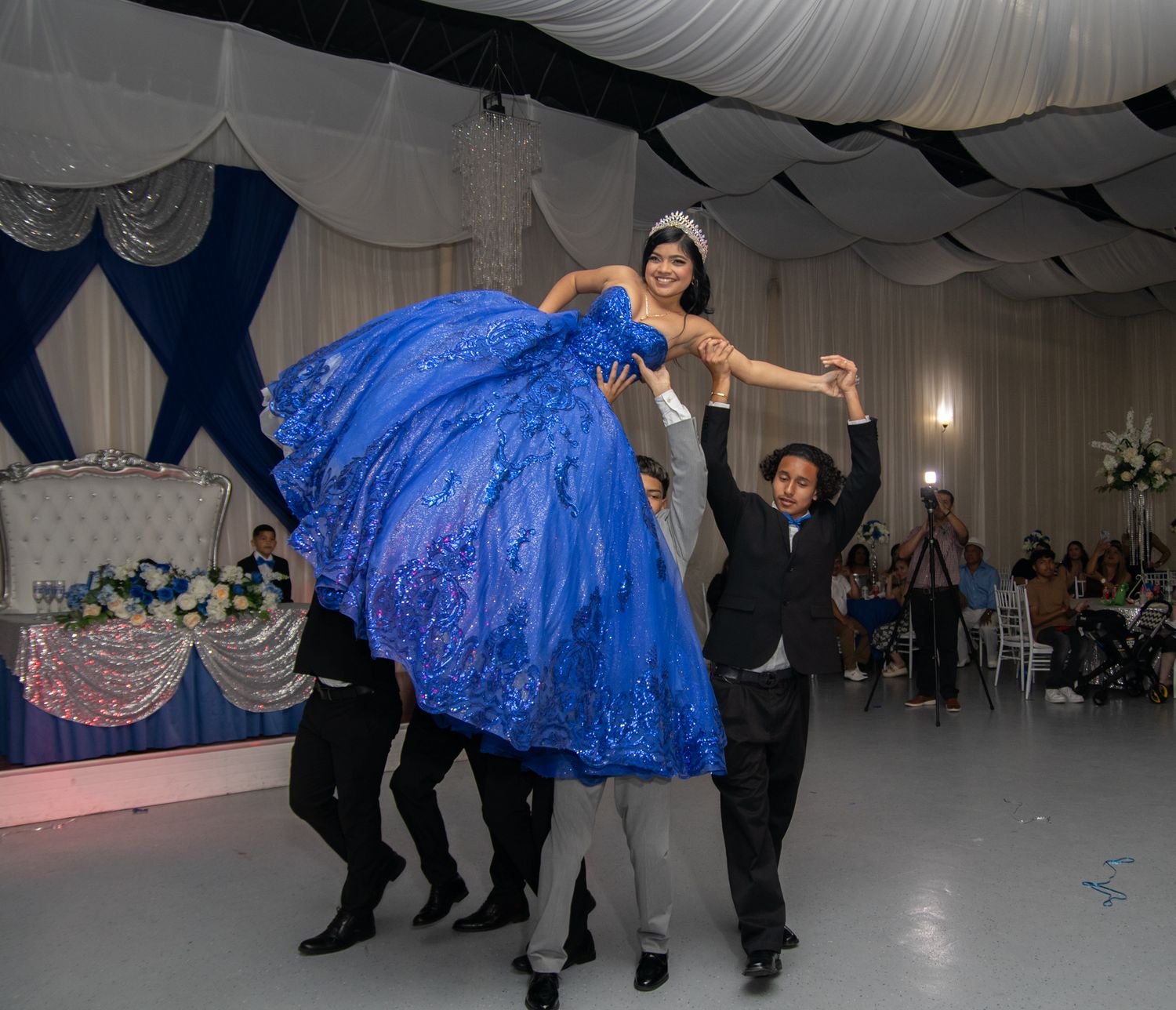 Court picking up blue dress Quinceanera