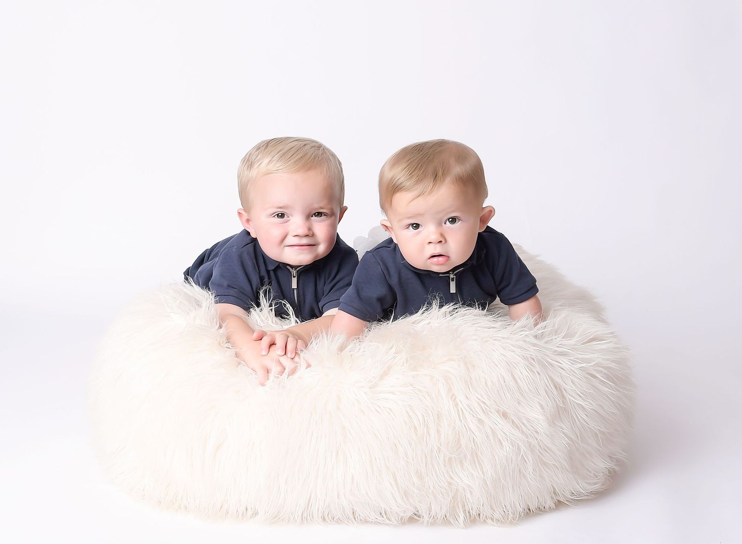 Brothers studio photography by Nicola in Woodside, white fluffy beanbag and clean white background capturing natural connection