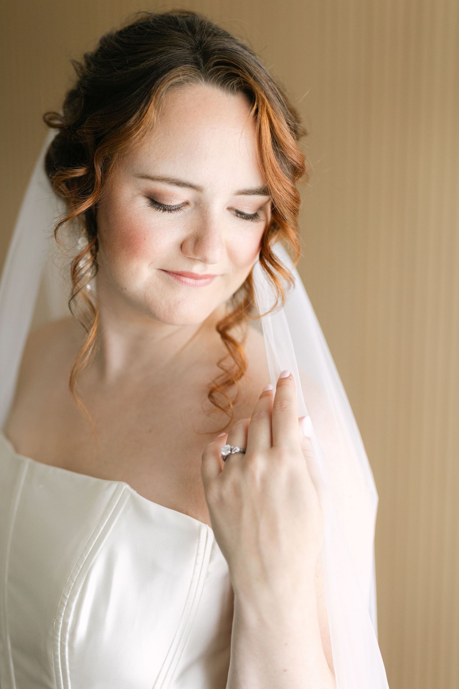 Mountain wedding portrait with evergreen forest backdrop and white floral bouquet.