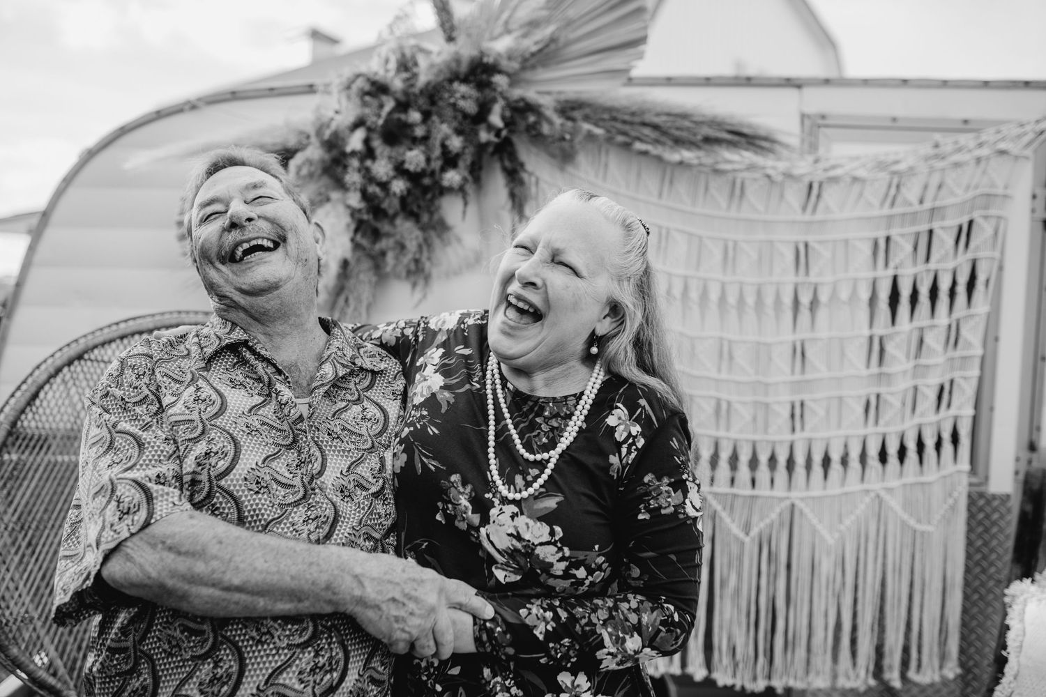 Black and white candid moments showing laughter and joy.