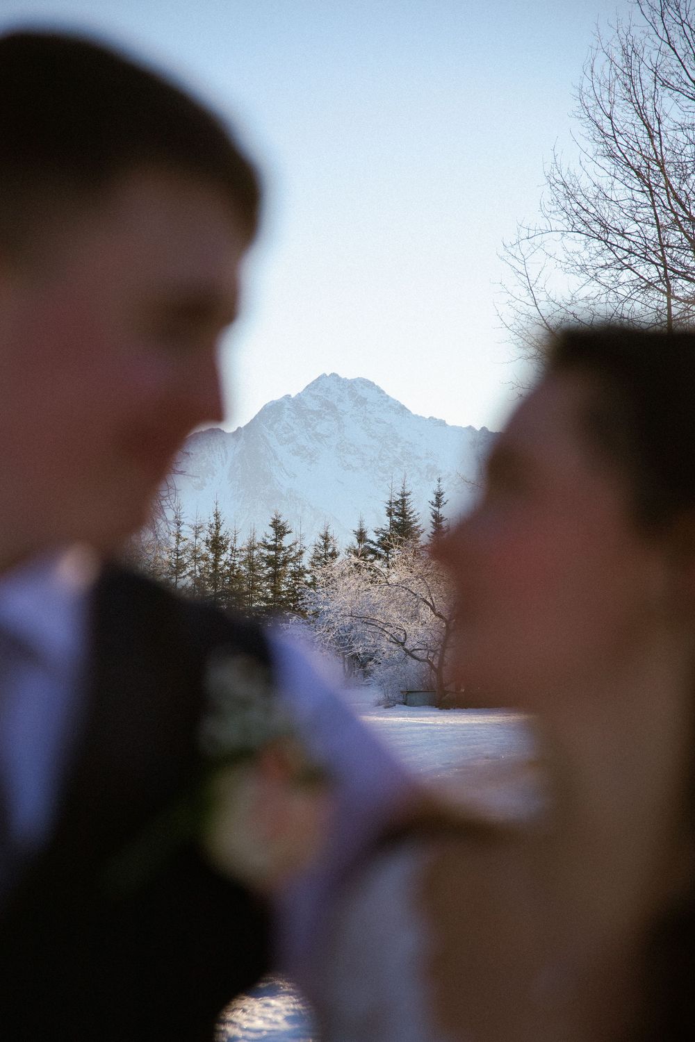 An Alaskan outdoor elopment featuring a beautiful mountain in the background!