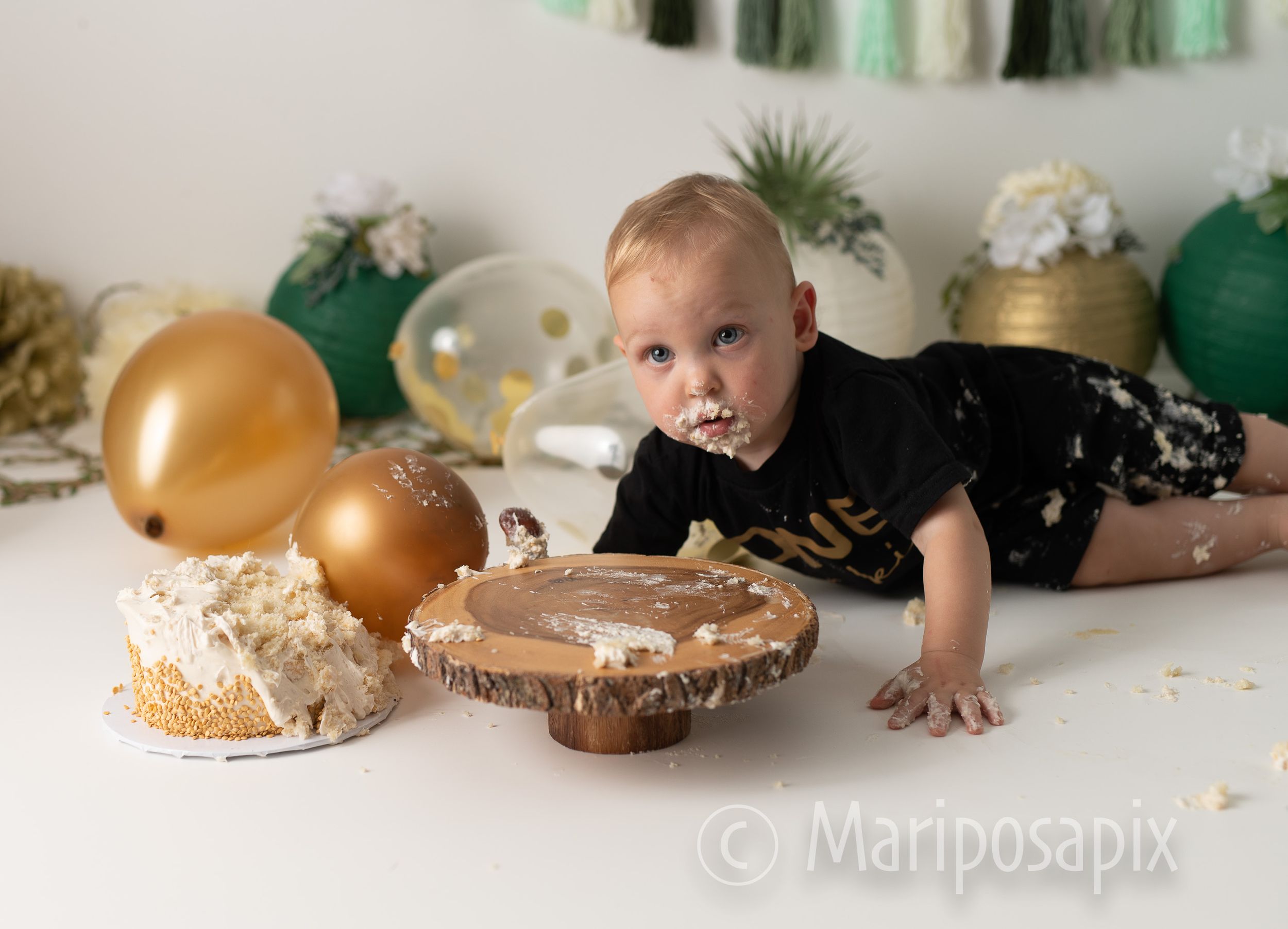 fun and messy cake smash with balloons and cake that we provide