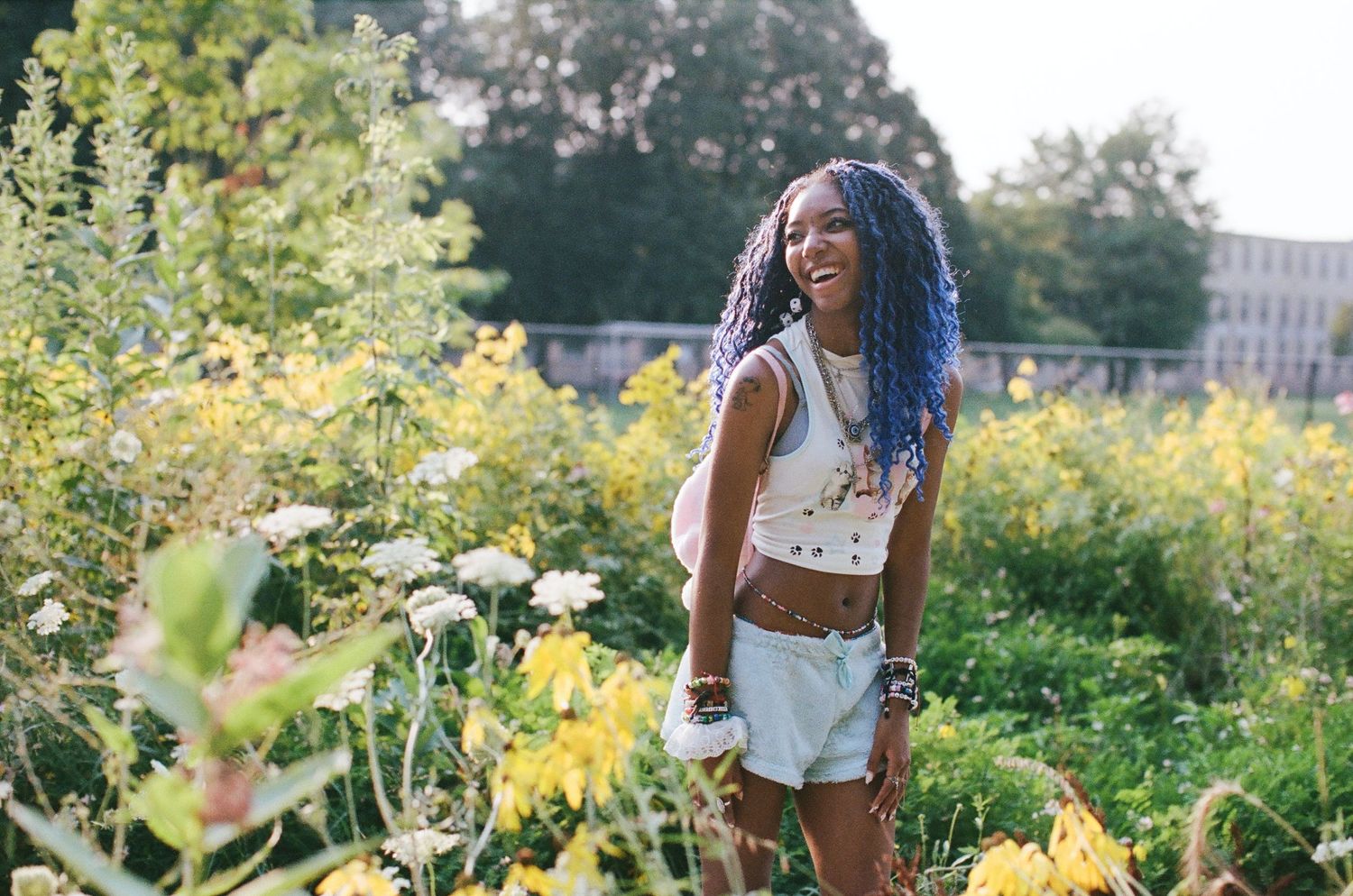 Summer photography session among blooming wildflowers and natural scenery.