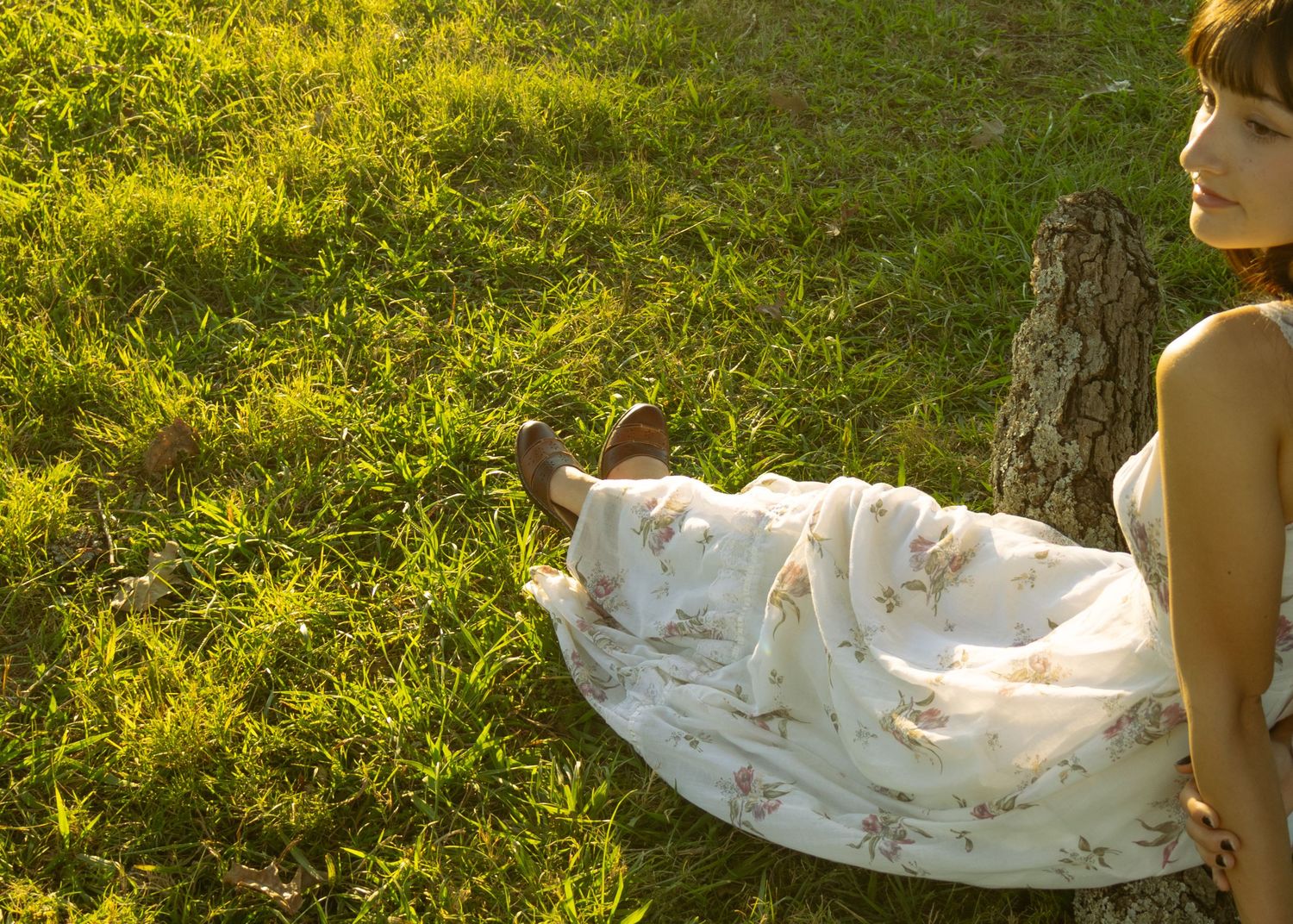 Girl sitting in grass