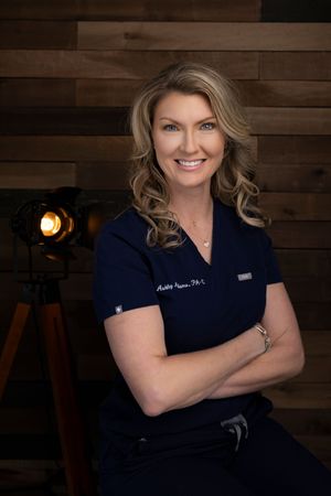 Professional headshots of a medical provider in a navy blue uniform against a dark wooden wall background.