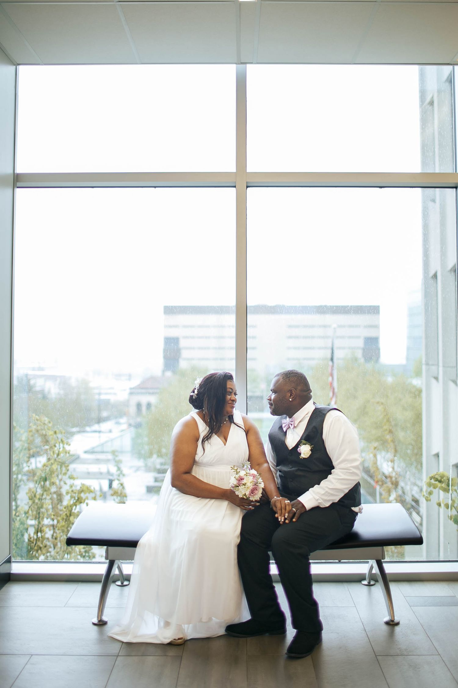 Everett micro wedding photographer: A couple poses for a portrait after their court wedding ceremony at the Everett WA Courthouse