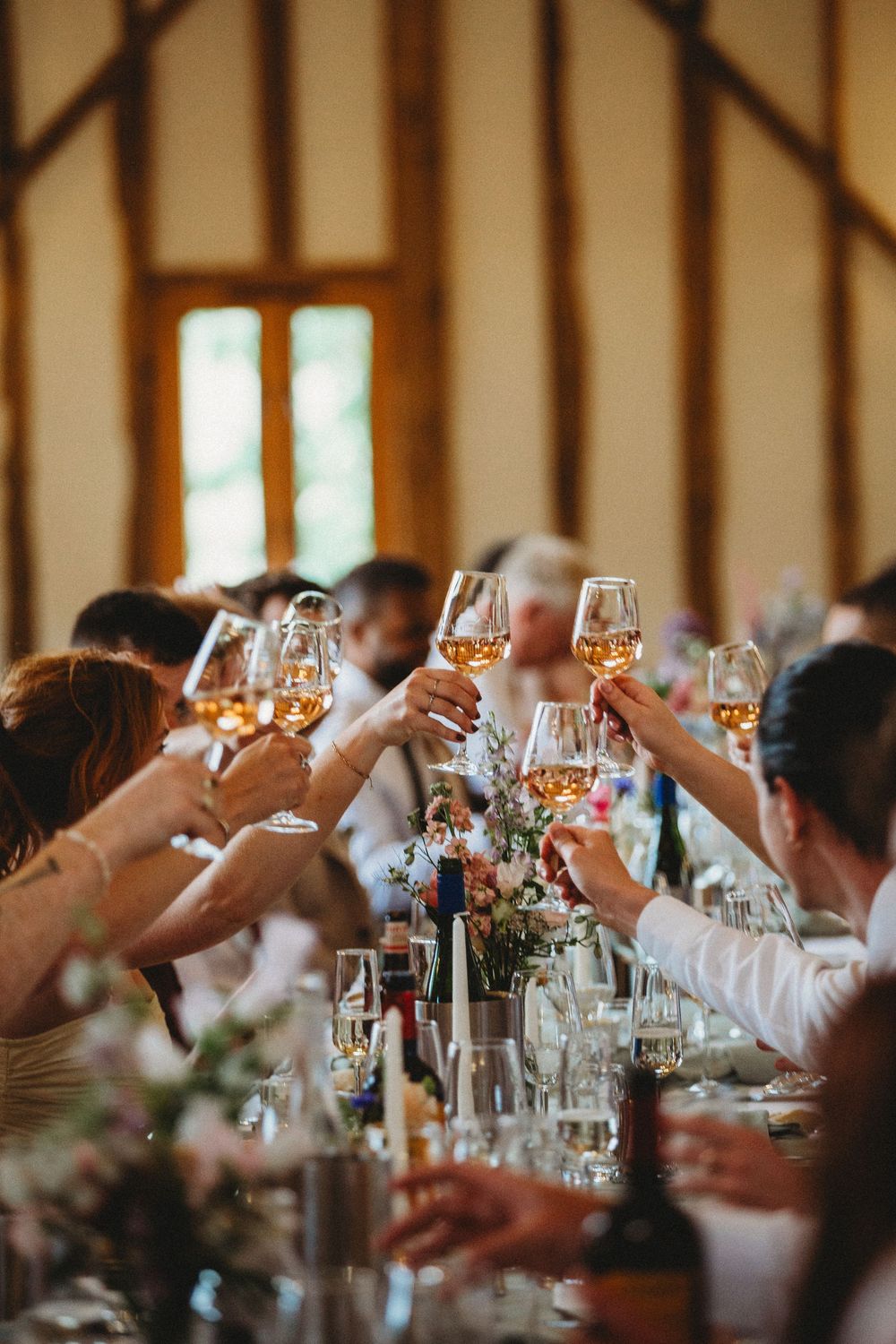 Candid phot of guests sharing a toast at Bruisyard