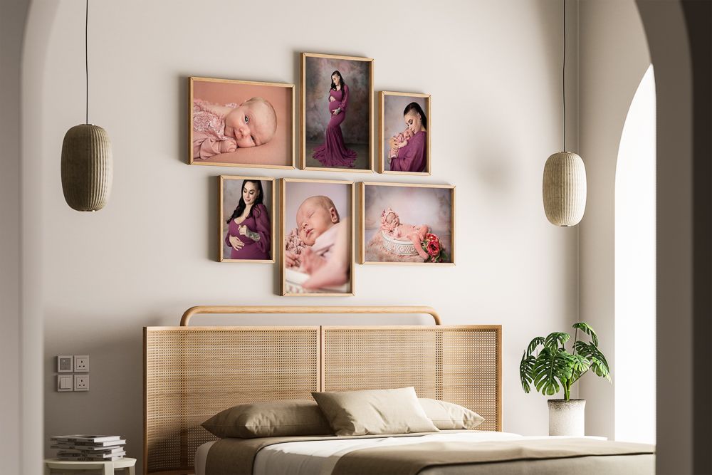 Modern bedroom interior with wooden headboard, white walls, framed artwork, and sconce lighting fixtures.