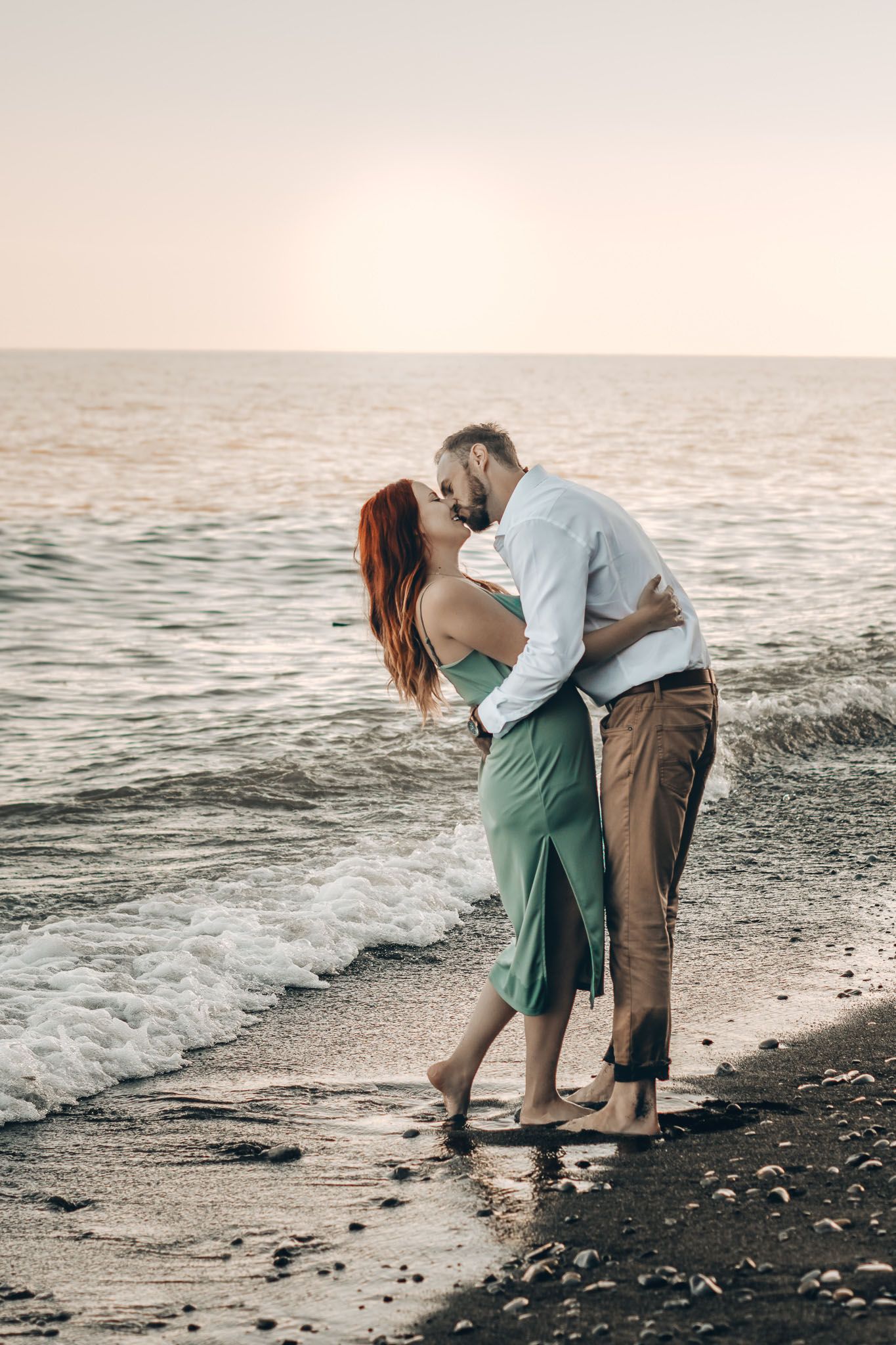Couple kissing on the beach