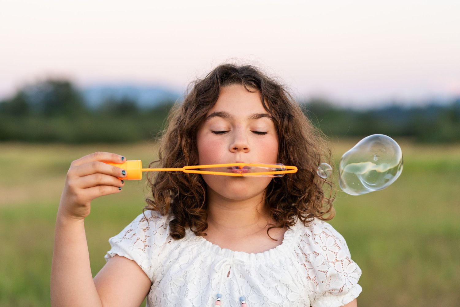 Daughter blowing bubbles at Marymoor Park