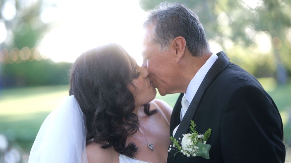 A series of romantic wedding photos showing couples embracing and kissing in outdoor garden settings.