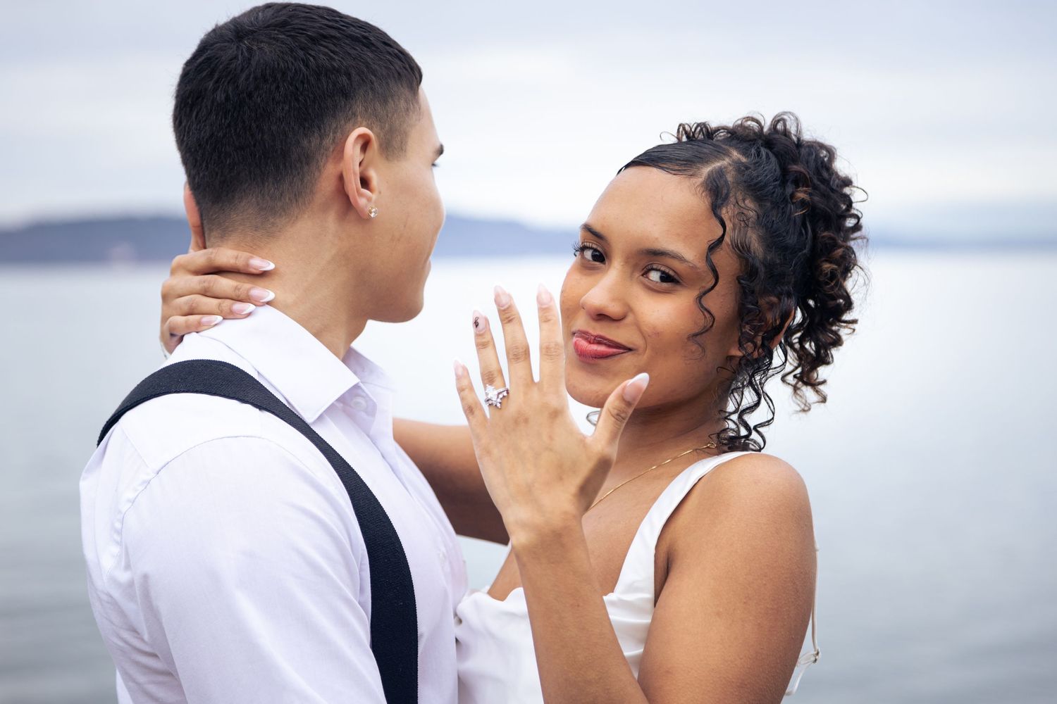Bride and groom share intimate moments during their beach wedding photoshoot at sunset.