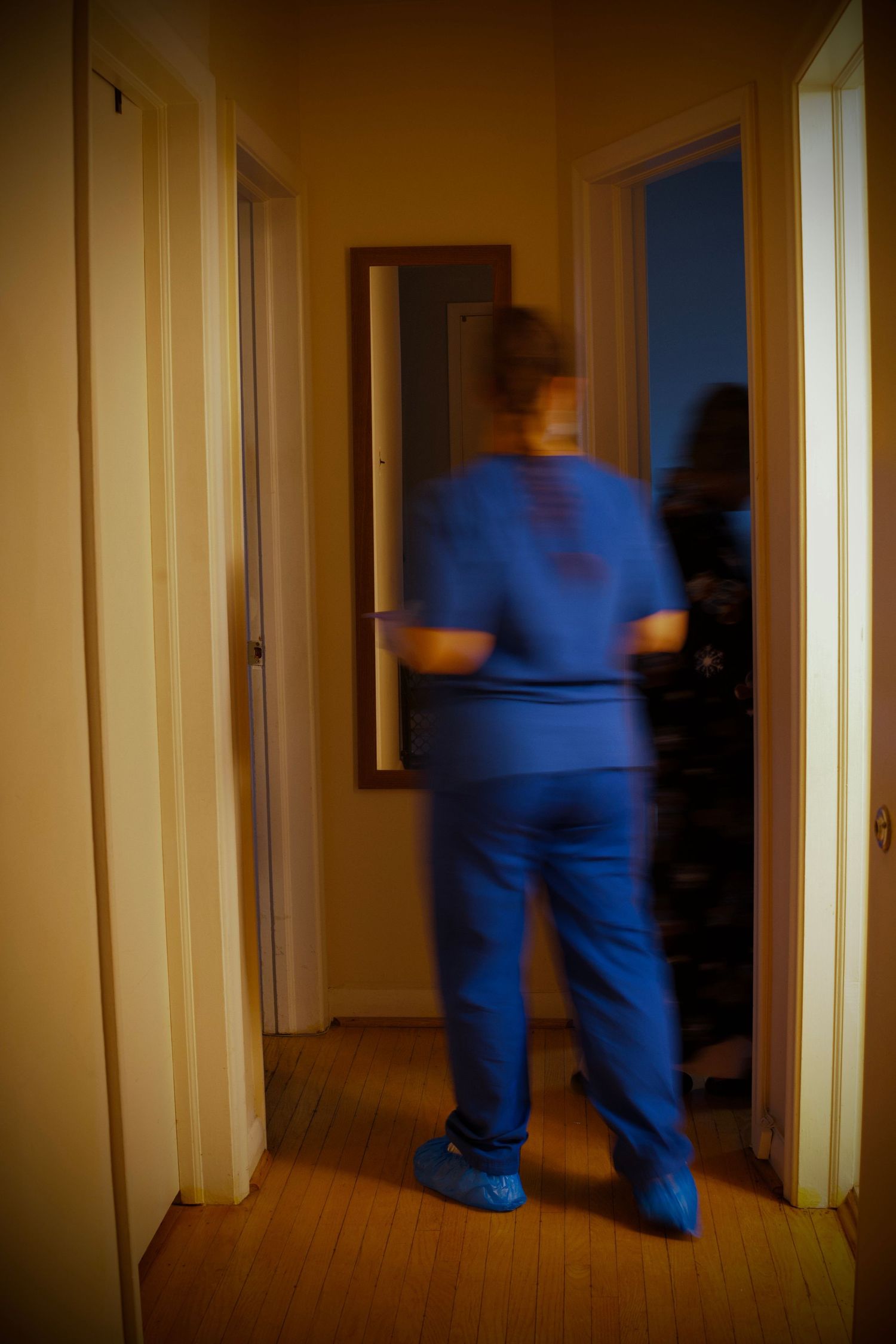 Blurry photo of a girl walking in a hallway