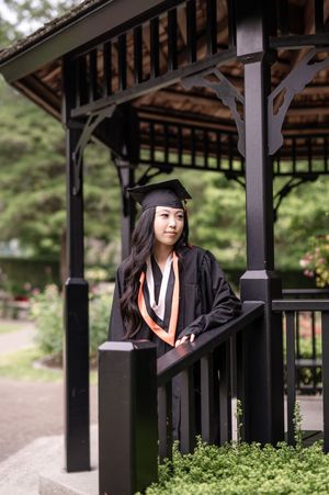 A sequence of graduation portraits taken under a dark wooden gazebo structure with green scenery in background.
