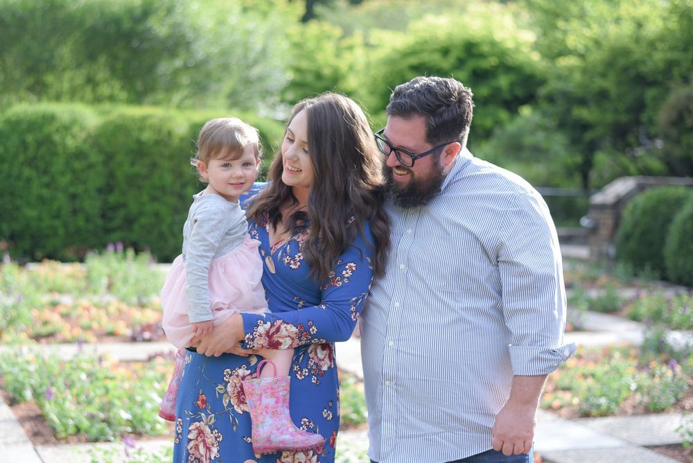 Family enjoying quality time together in a peaceful garden setting.