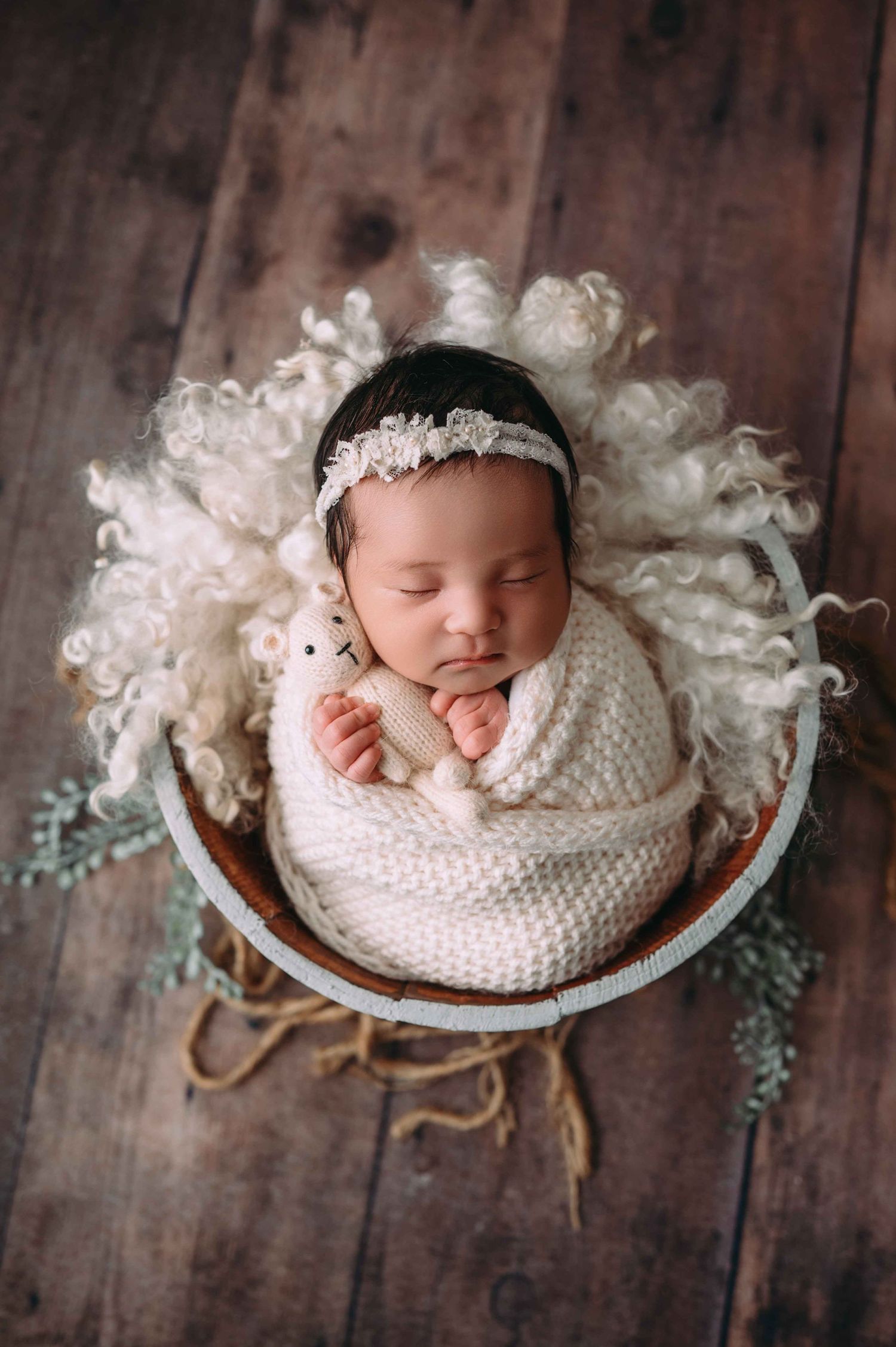 Custom newborn portrait with European-inspired styling at Woodbury’s premier newborn studio
