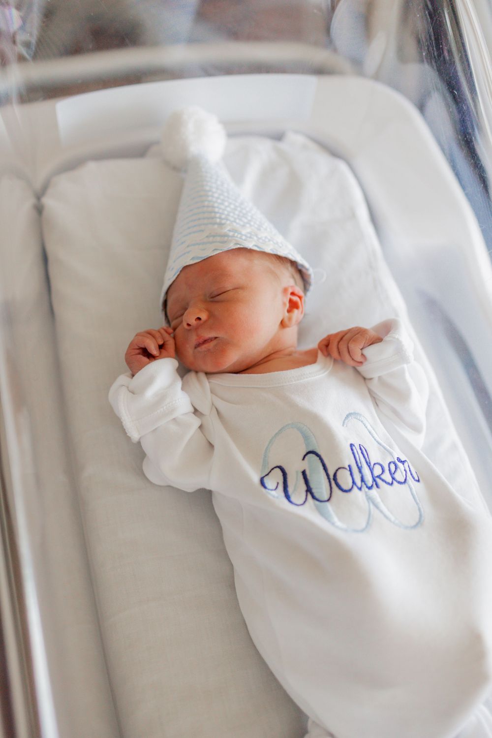 newborn in birthday hat