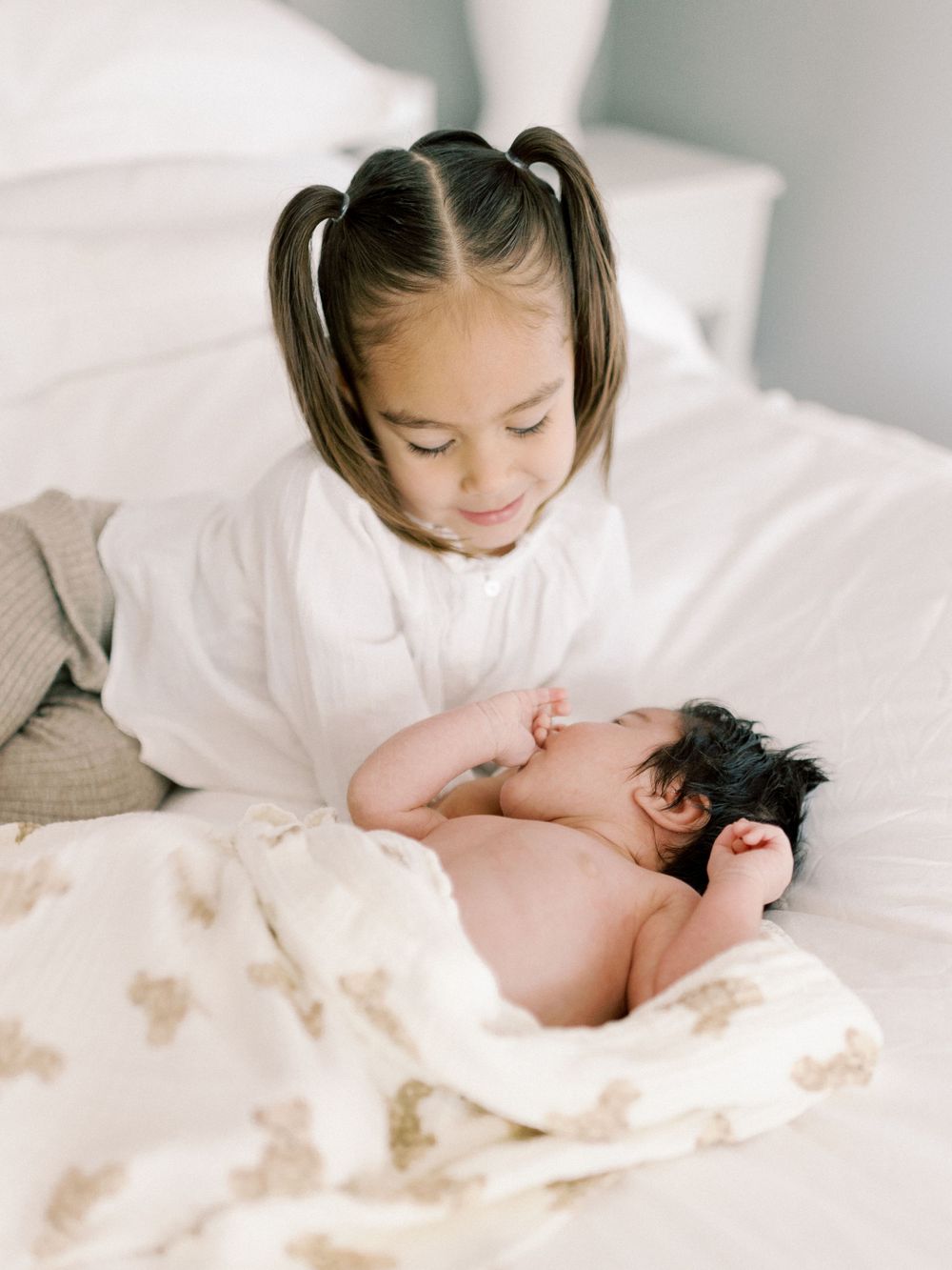 Newborn session with sister and new baby brother. Taken by Kaitlin Stoltenberg, Family and Newborn Photographer in Chico, California.