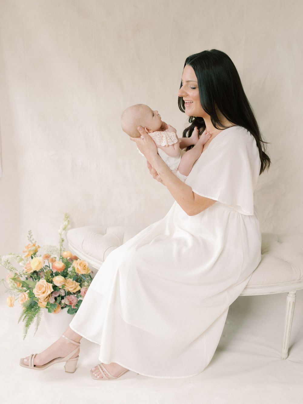 Mother and her new baby in a studio. Taken by Kaitlin Stoltenberg, Family and Newborn Photographer in Chico, California.