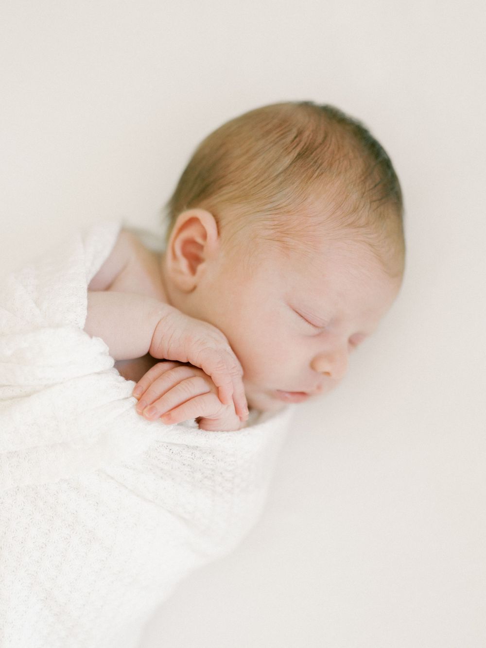 Lifestyle Newborn photo of baby taken in home. Taken by Kaitlin Stoltenberg, Family and Newborn Photographer in Chico, California.
