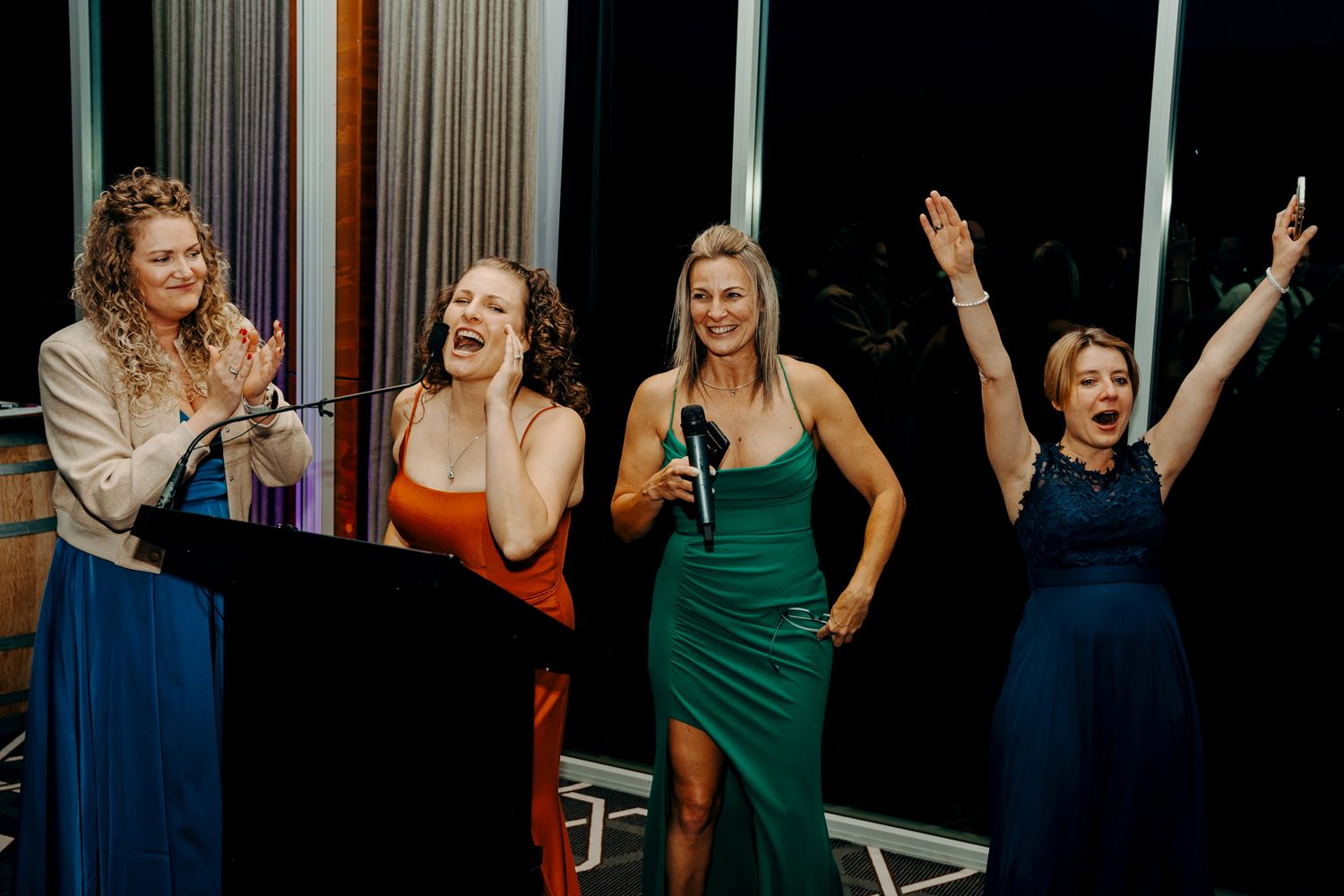 Wedding guests enjoying themselves and dancing at a celebration event.