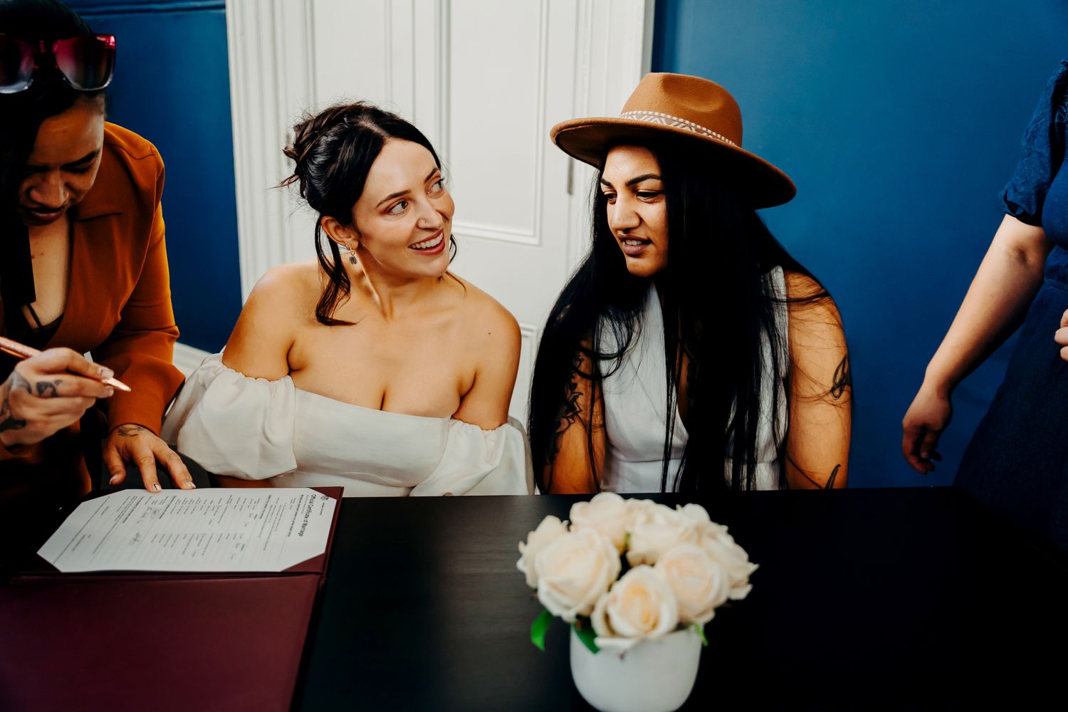 Wedding photos showing moments of joy and preparation as people get ready and celebrate in stylish formal attire.