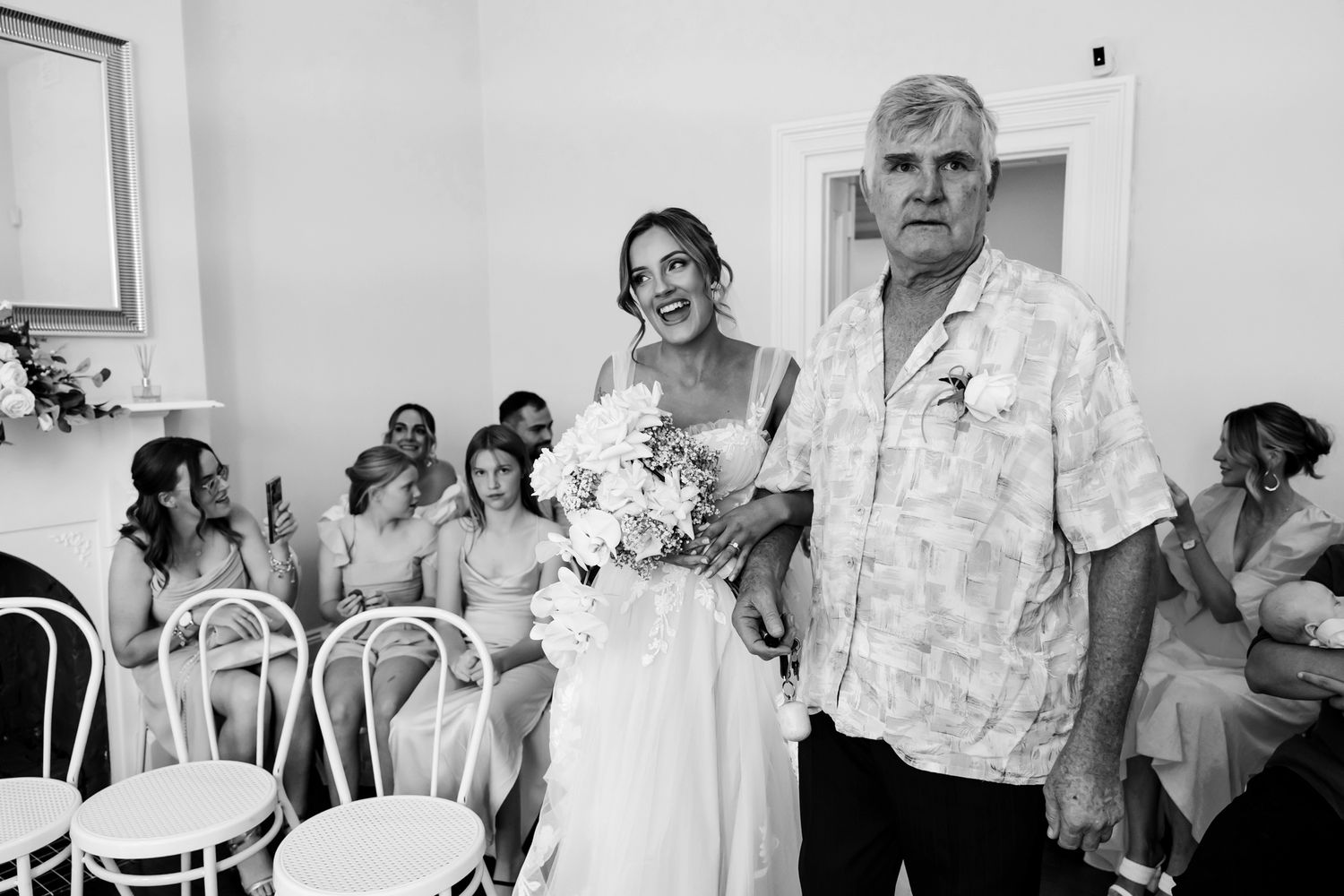 A series of candid moments during a wedding event showing preparations and conversations in a white interior setting.