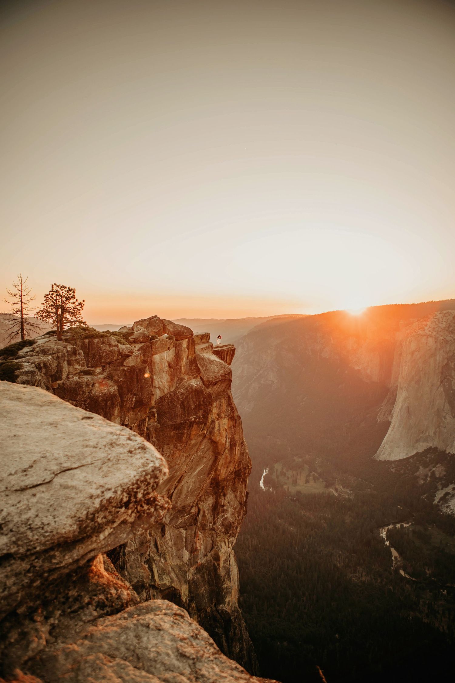 Dramatic sunset view of Yosemite Valley from Taft Point overlook with golden light.