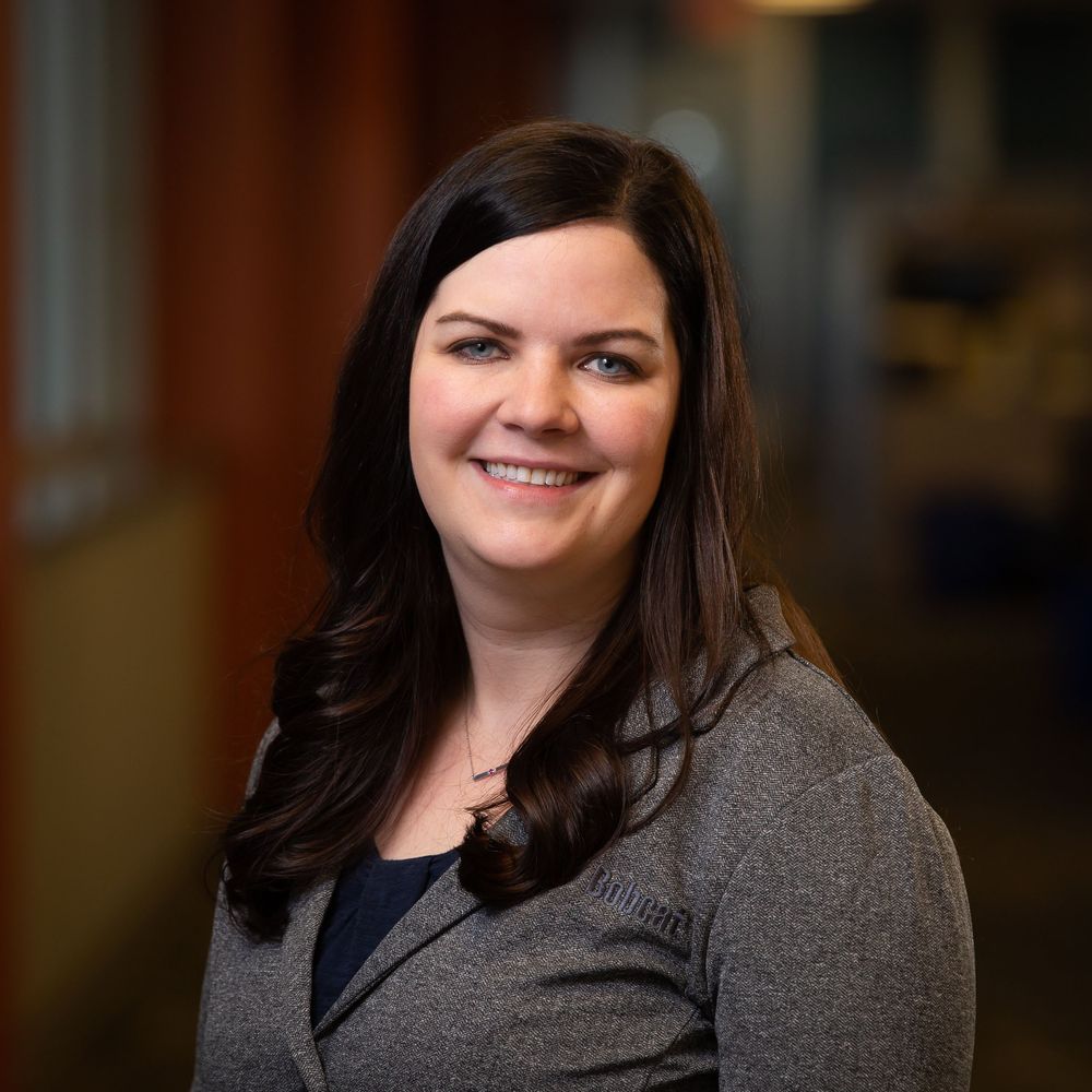 Professional female executive smiling during an on-location headshot session