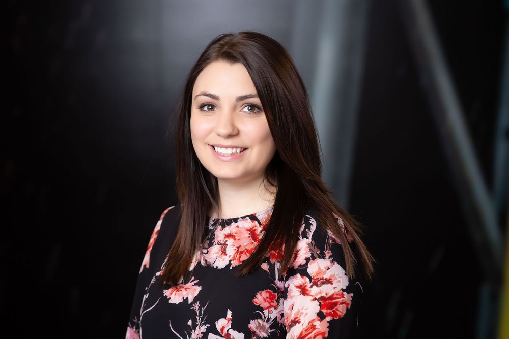 Professional female executive smiling during an on-location headshot session